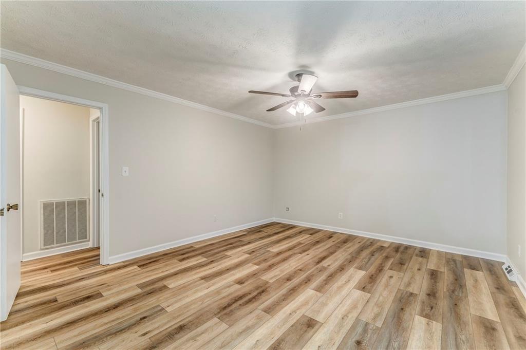 10 Thornwood Drive Southwest Rome, GA 30165 - Photo 33 of 57 a view of an empty room with a chandelier fan
