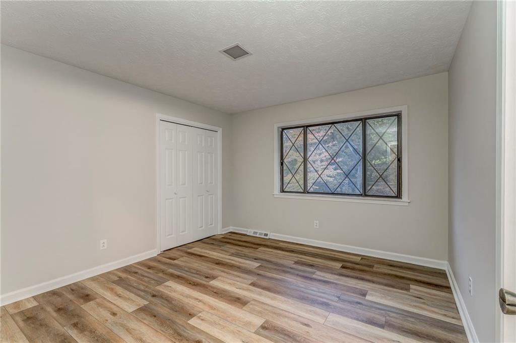 10 Thornwood Drive Southwest Rome, GA 30165 - Photo 43 of 57 a view of a room with wooden floor and window