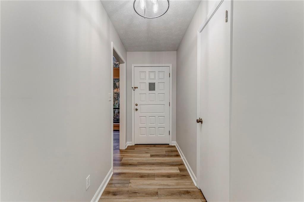10 Thornwood Drive Southwest Rome, GA 30165 - Photo 48 of 57 a view of a hallway with wooden floor and staircase