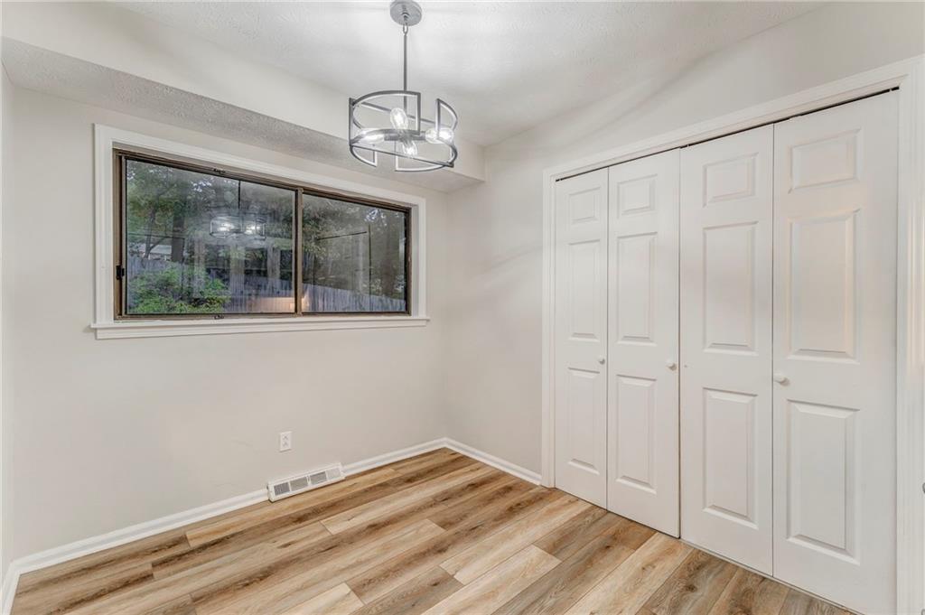 10 Thornwood Drive Southwest Rome, GA 30165 - Photo 8 of 57 a view of empty room with window and wooden floor