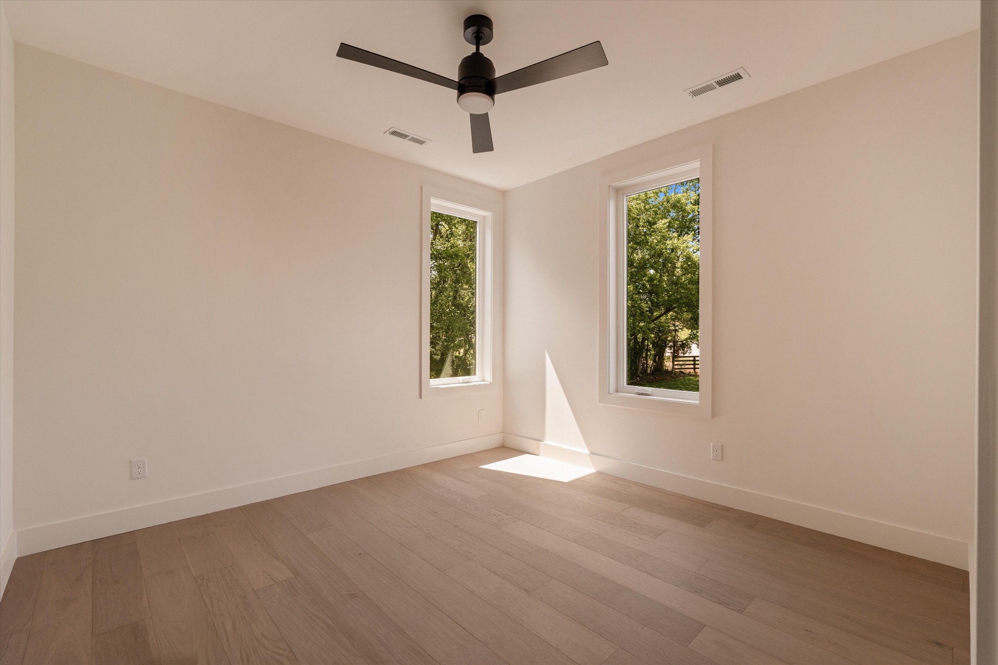 6801 Flat Creek Road College Grove, TN 37046 - Photo 53 of 66 an empty room with a window and a ceiling fan