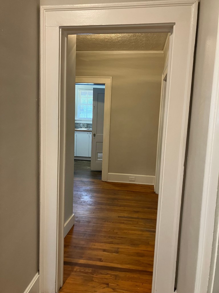 2318 Huggins Street Columbus, GA 31903 - Photo 11 of 40 a view of a hallway with wooden floor