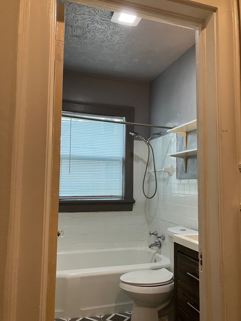 2318 Huggins Street Columbus, GA 31903 - Photo 14 of 40 a bathroom with a toilet a sink and a bathtub
