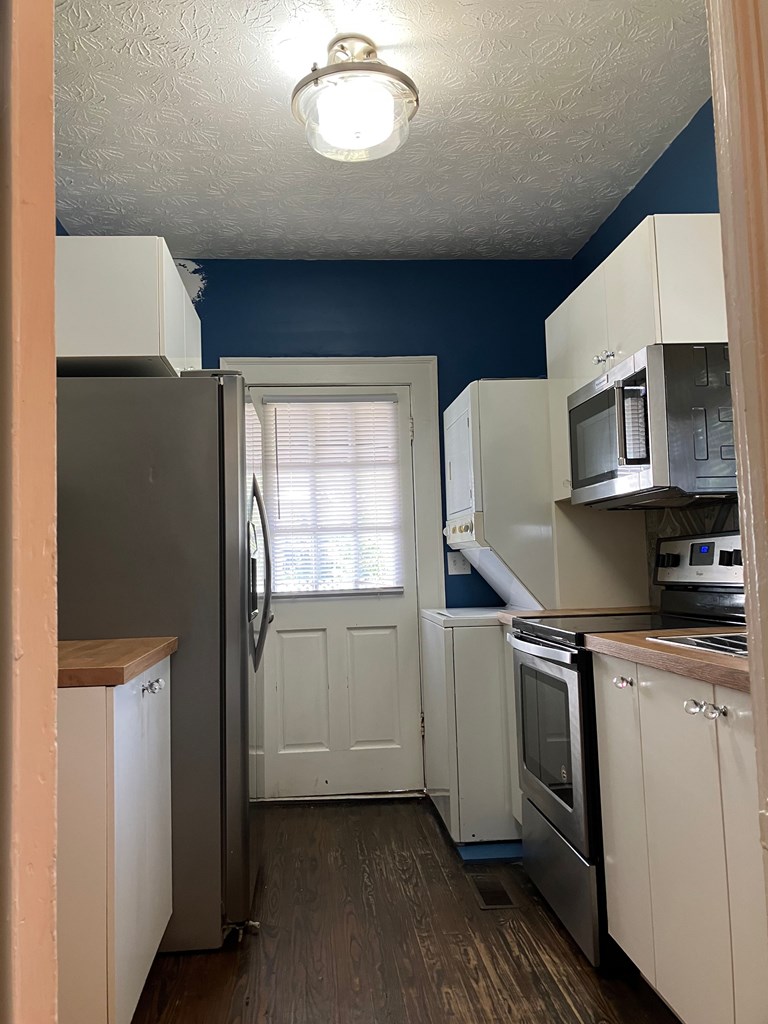 2318 Huggins Street Columbus, GA 31903 - Photo 21 of 40 a kitchen with a refrigerator and a stove