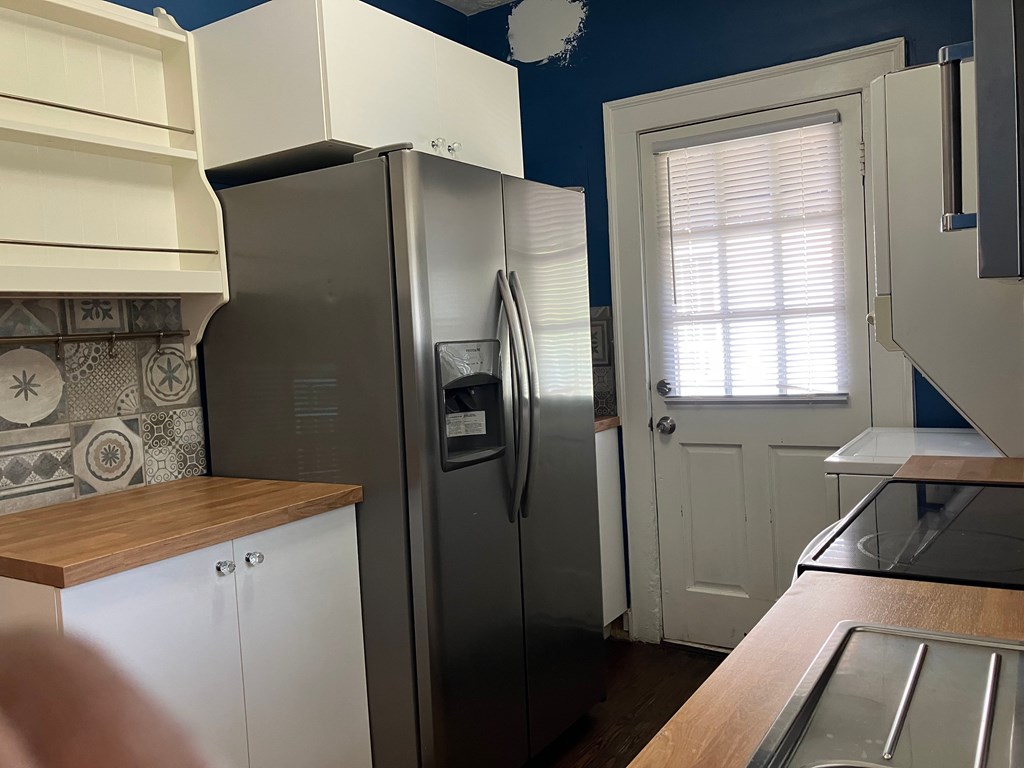 2318 Huggins Street Columbus, GA 31903 - Photo 24 of 40 a kitchen with a refrigerator and a stove