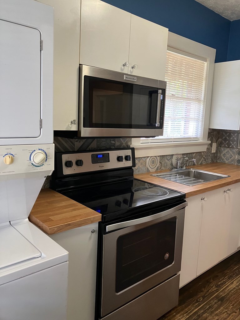 2318 Huggins Street Columbus, GA 31903 - Photo 30 of 40 a kitchen with a stove and a microwave oven