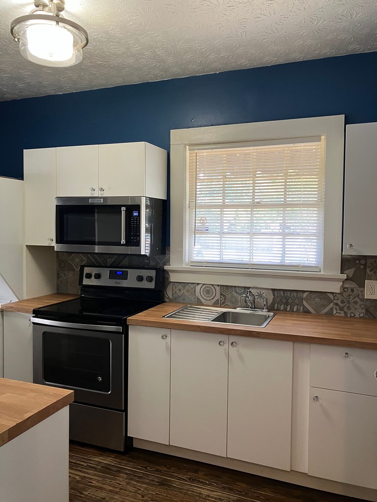 2318 Huggins Street Columbus, GA 31903 - Photo 33 of 40 a kitchen with a stove and a microwave