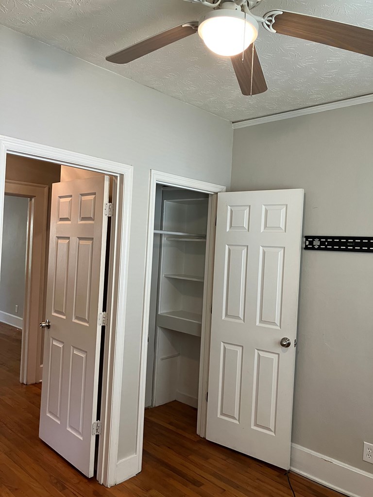 2318 Huggins Street Columbus, GA 31903 - Photo 37 of 40 a view of a hallway with wooden floor and staircase
