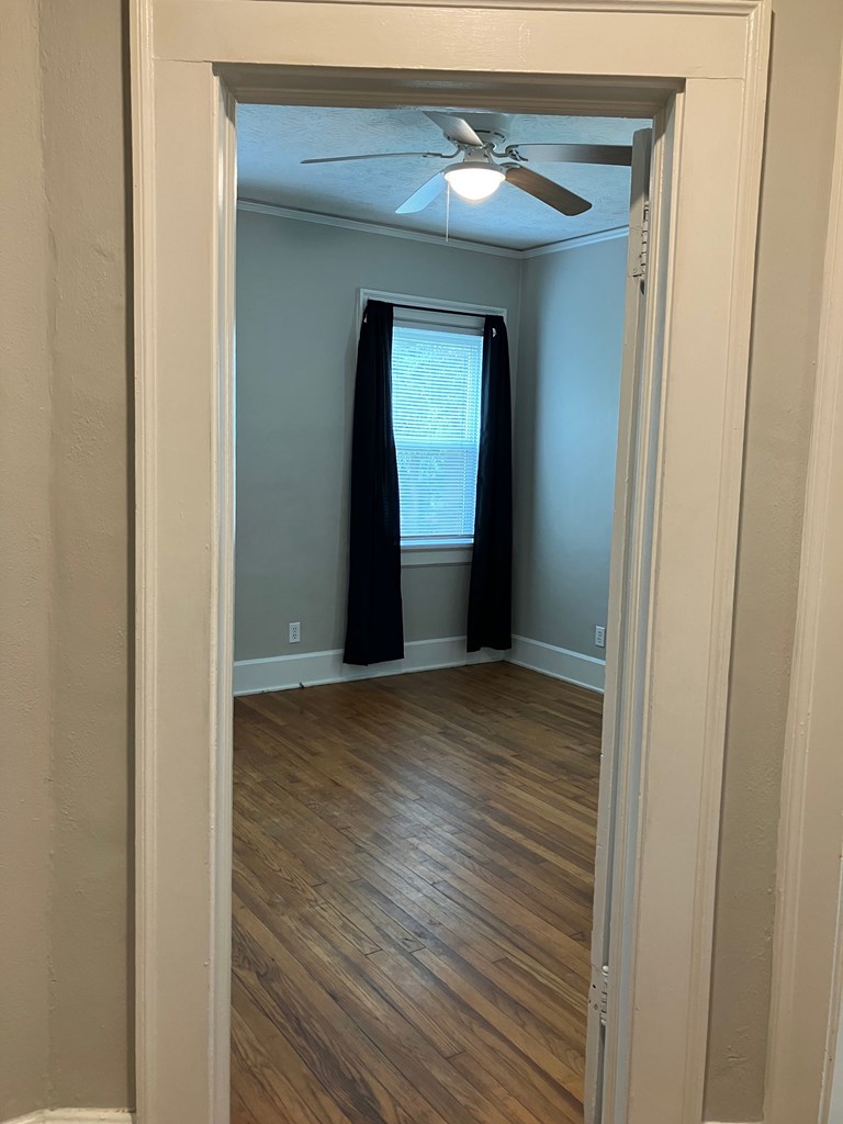 2318 Huggins Street Columbus, GA 31903 - Photo 6 of 40 a view of a hallway with wooden floor