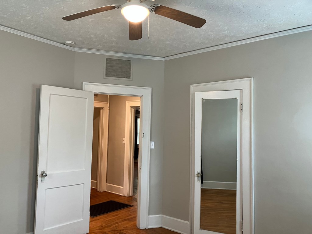 2318 Huggins Street Columbus, GA 31903 - Photo 10 of 40 a view of a hallway with wooden floor