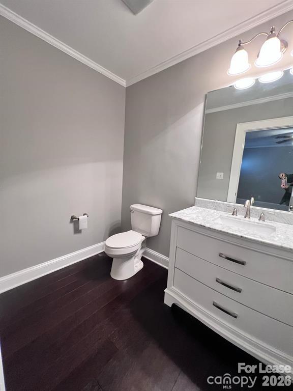 2104 Moose Road Kannapolis, NC 28083 - Photo 17 of 20 a bathroom with a toilet a sink and a mirror