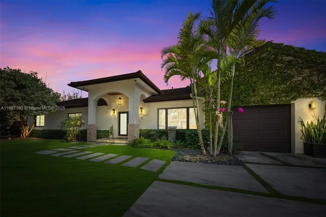 a front view of a house with a yard
