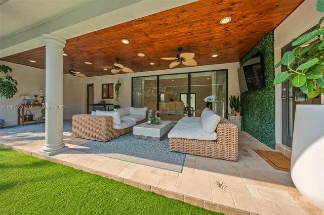 a view of a swimming pool with an outdoor seating