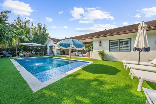 a view of a backyard with a patio