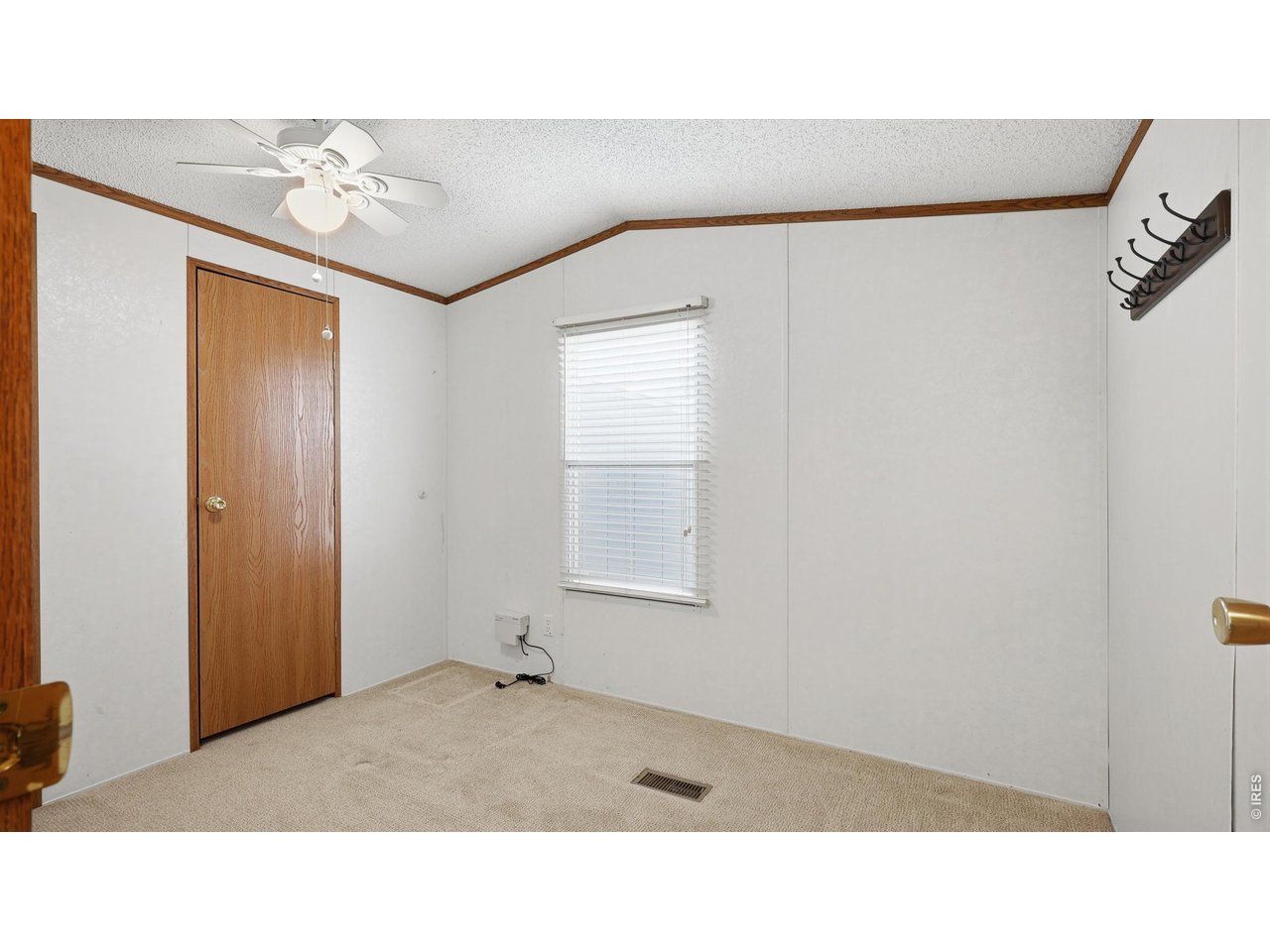 256 Navajo Road Weldona, CO 80653 - Photo 16 of 27 a bathroom with a sink and a mirror