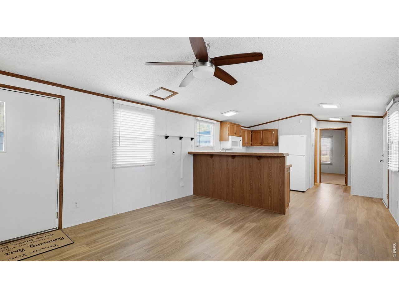 256 Navajo Road Weldona, CO 80653 - Photo 9 of 27 a bathroom with a sink and a mirror