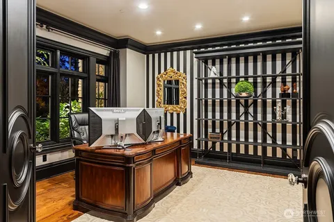 a view of a hallway with furniture and staircase