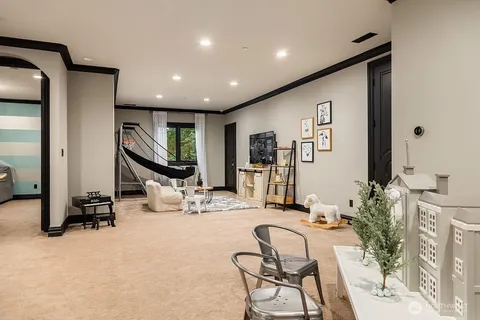 a room with gym equipment and a large mirror