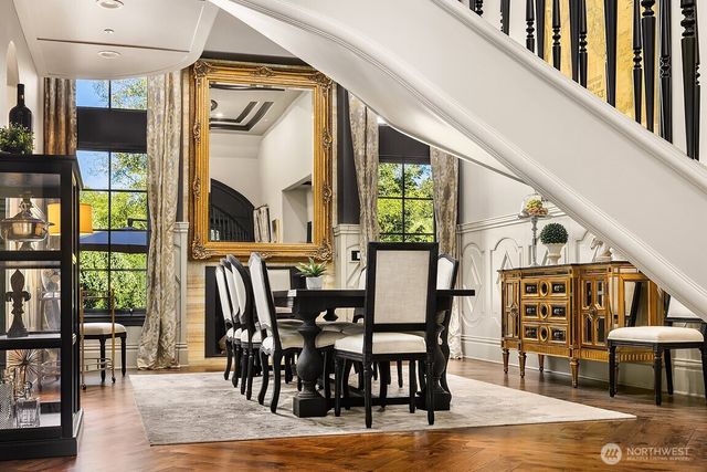 a view of a dining room with furniture window and wooden floor