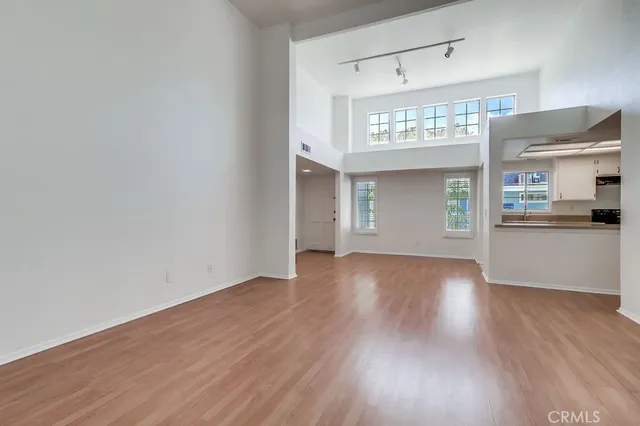 a kitchen with granite countertop a sink and cabinets