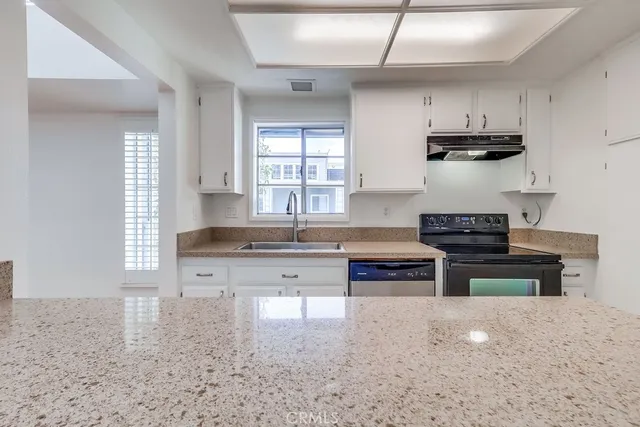 a view of an empty room and wooden floor
