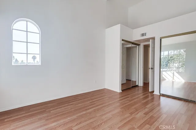 a view of wooden floor in an empty room