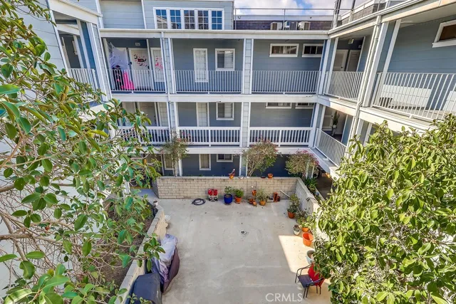a front view of a house with many windows