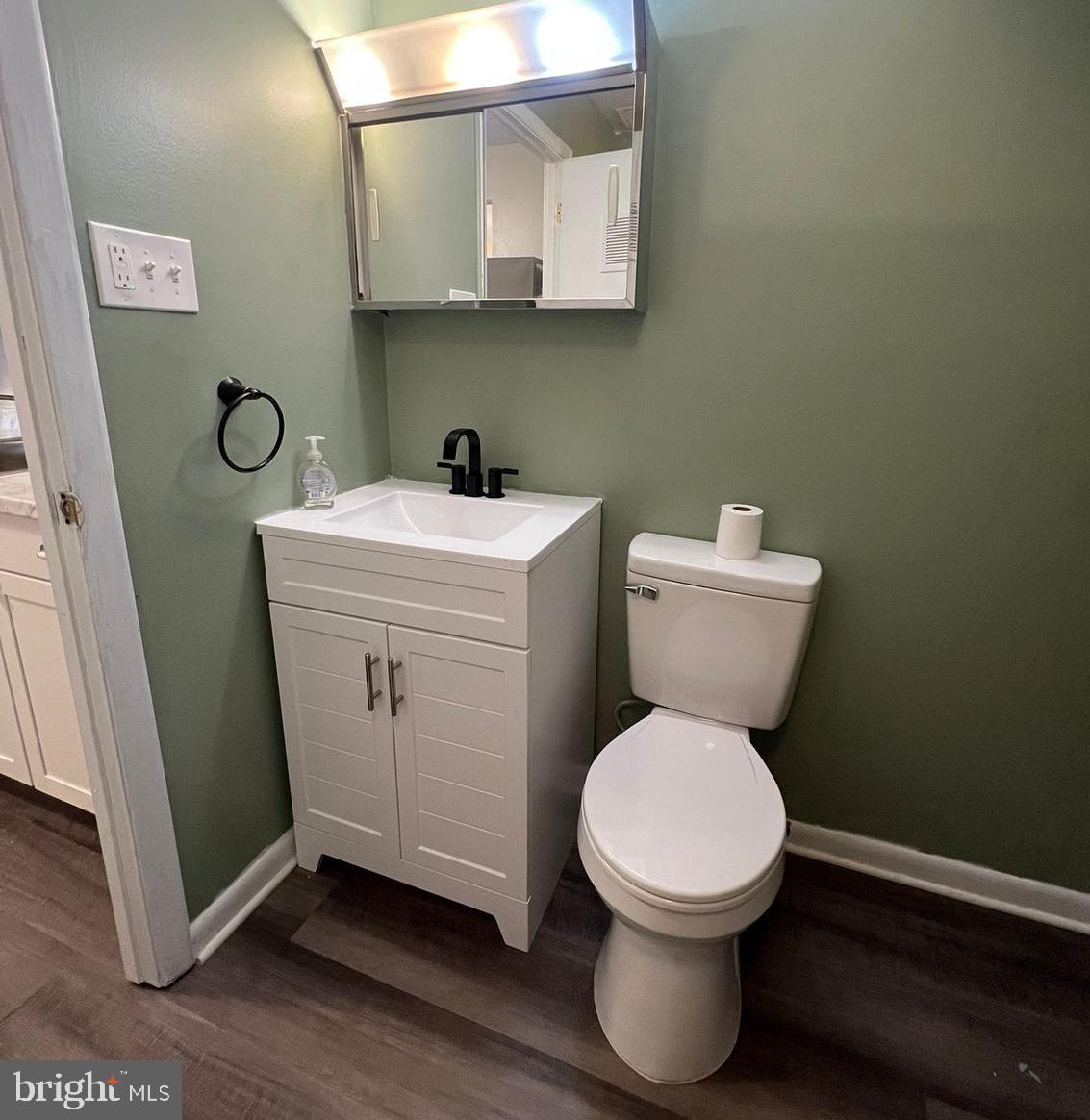 9655 Homestead Court, Unit B Laurel, MD 20723 - Photo 3 of 10 a bathroom with a toilet and a sink