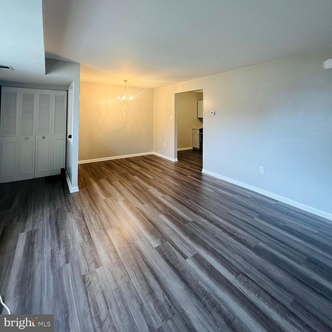 9655 Homestead Court, Unit B Laurel, MD 20723 - Photo 8 of 10 a view of an empty room and wooden floor