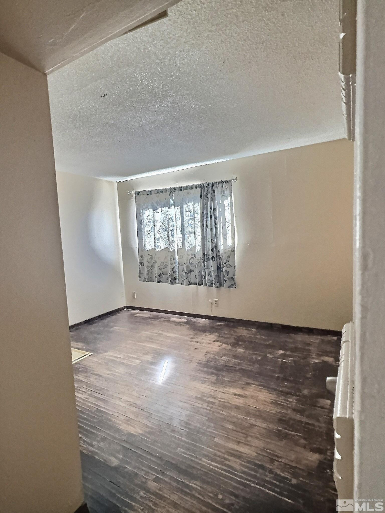 1201 Silverada Boulevard Reno, NV 89512 - Photo 8 of 16 a view of an empty room with a window