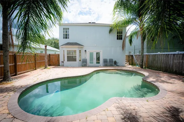 a view of a house with swimming pool