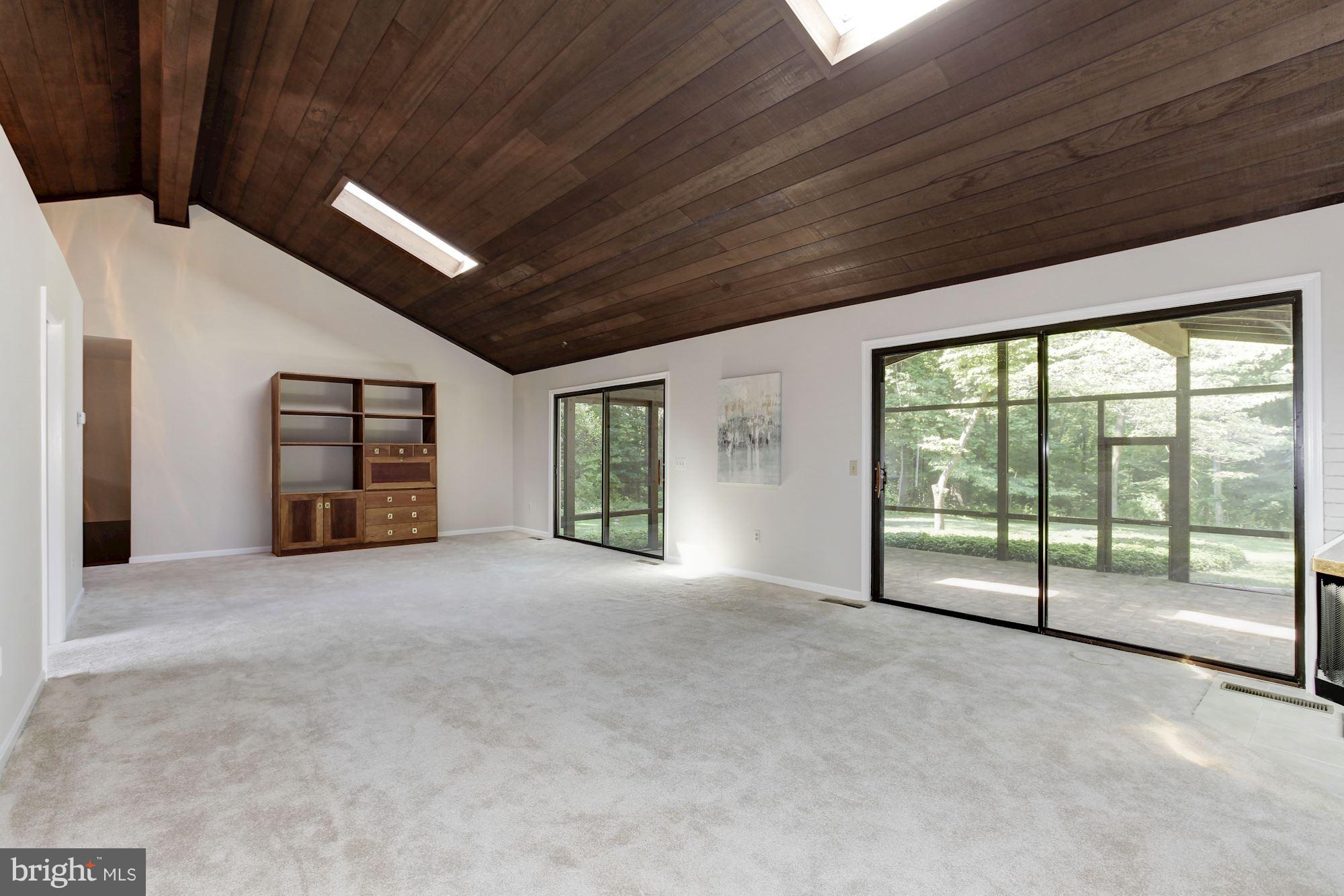 1666 Winchester Road Annapolis, MD 21409 - Photo 12 of 25 LR/DR with sliders to spacious screened-in porch