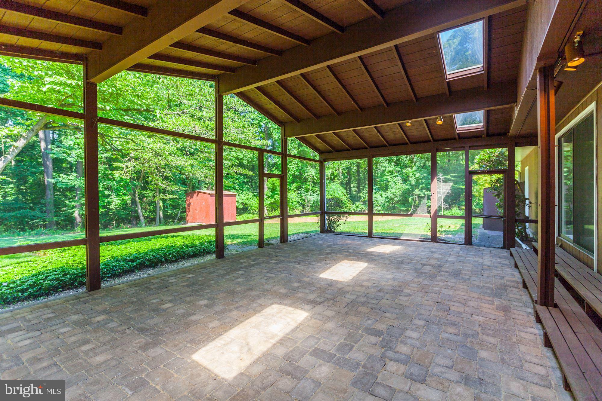 1666 Winchester Road Annapolis, MD 21409 - Photo 23 of 25 Screened-in Porch with brick floor