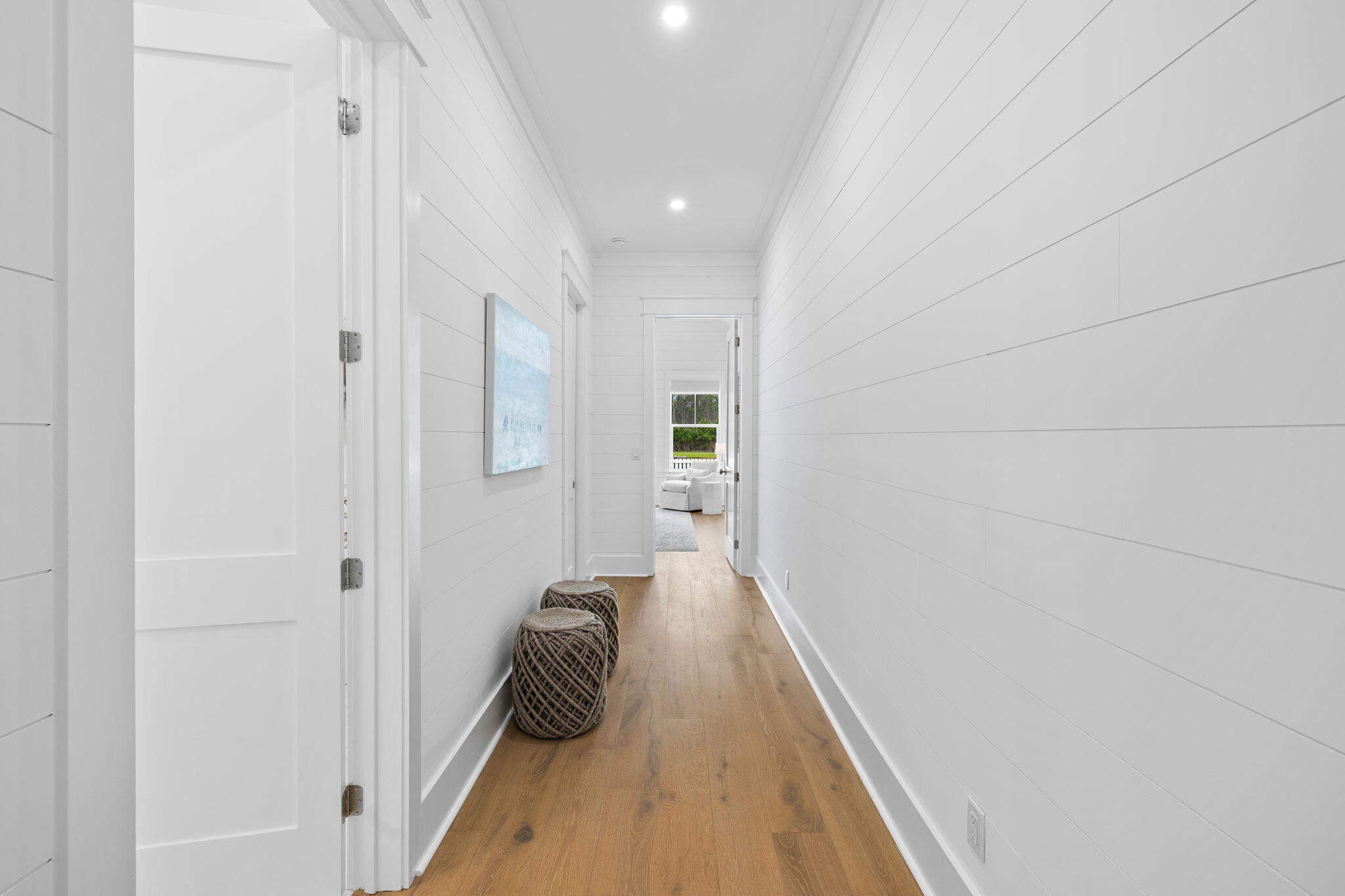 41 Seastone Ct Inlet Beach Inlet Beach, FL 32461 - Photo 19 of 52 a view of a hallway with wooden floor and staircase