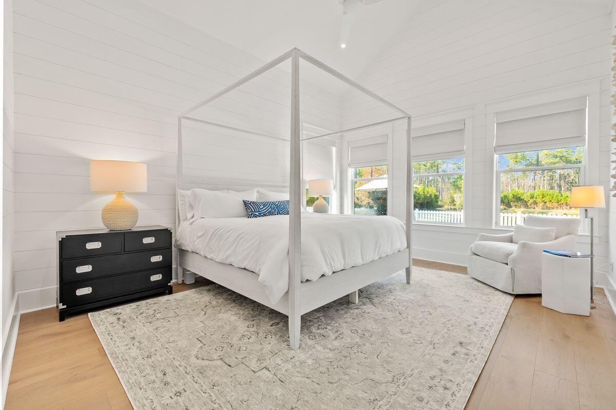 41 Seastone Ct Inlet Beach Inlet Beach, FL 32461 - Photo 21 of 52 a bedroom with a bed and large windows