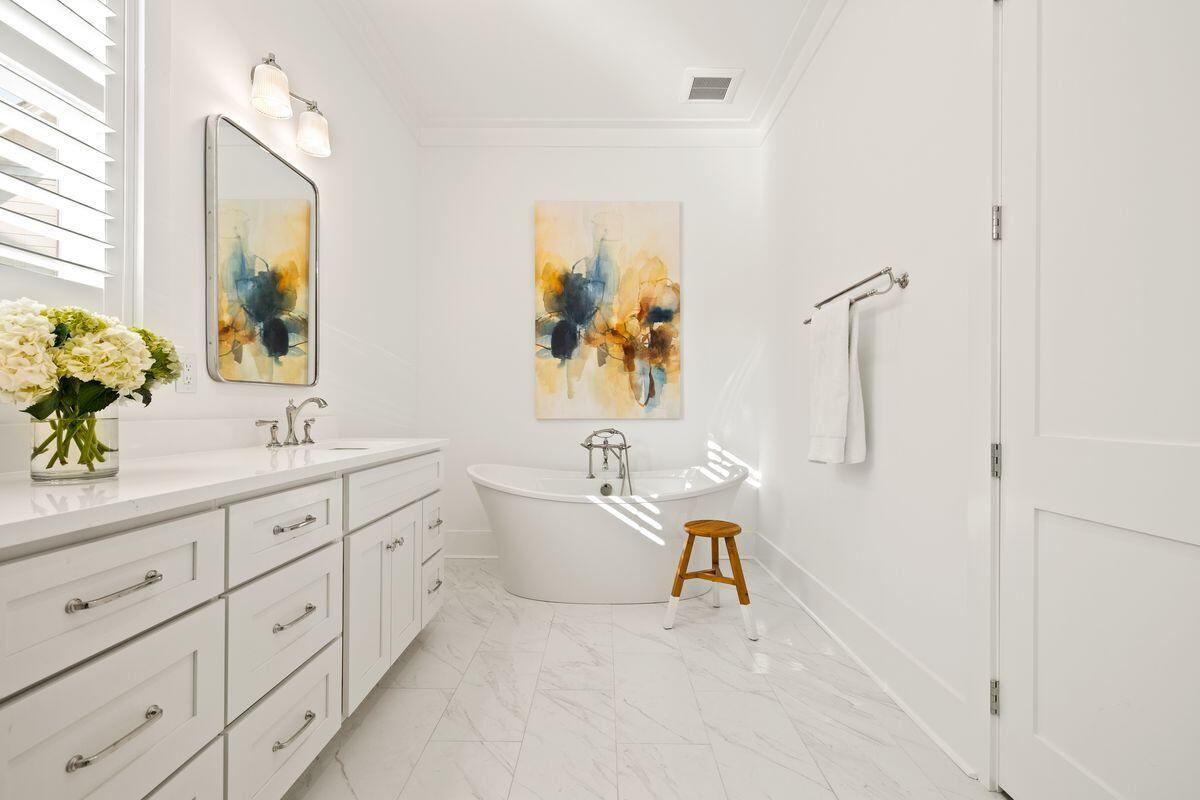 41 Seastone Ct Inlet Beach Inlet Beach, FL 32461 - Photo 23 of 52 a bathroom with a tub sink and mirror