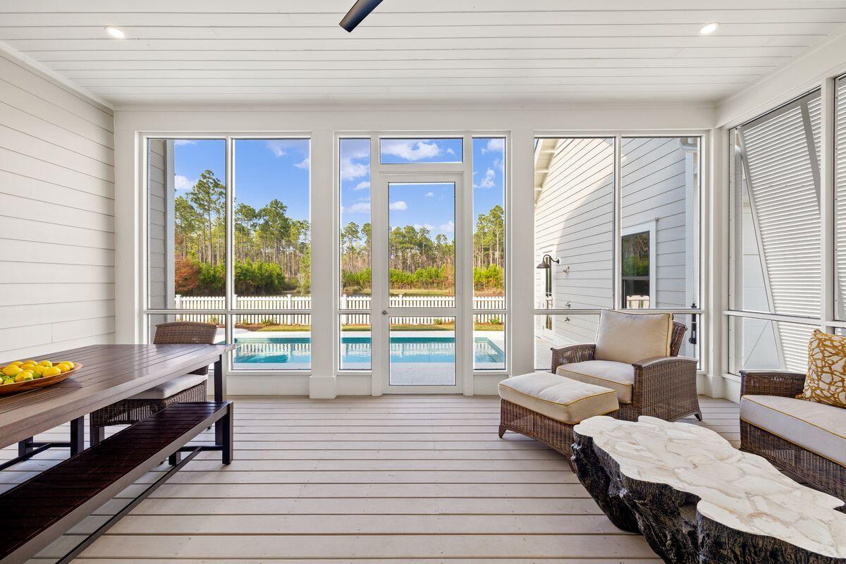 41 Seastone Ct Inlet Beach Inlet Beach, FL 32461 - Photo 25 of 52 a living room with furniture and a large window
