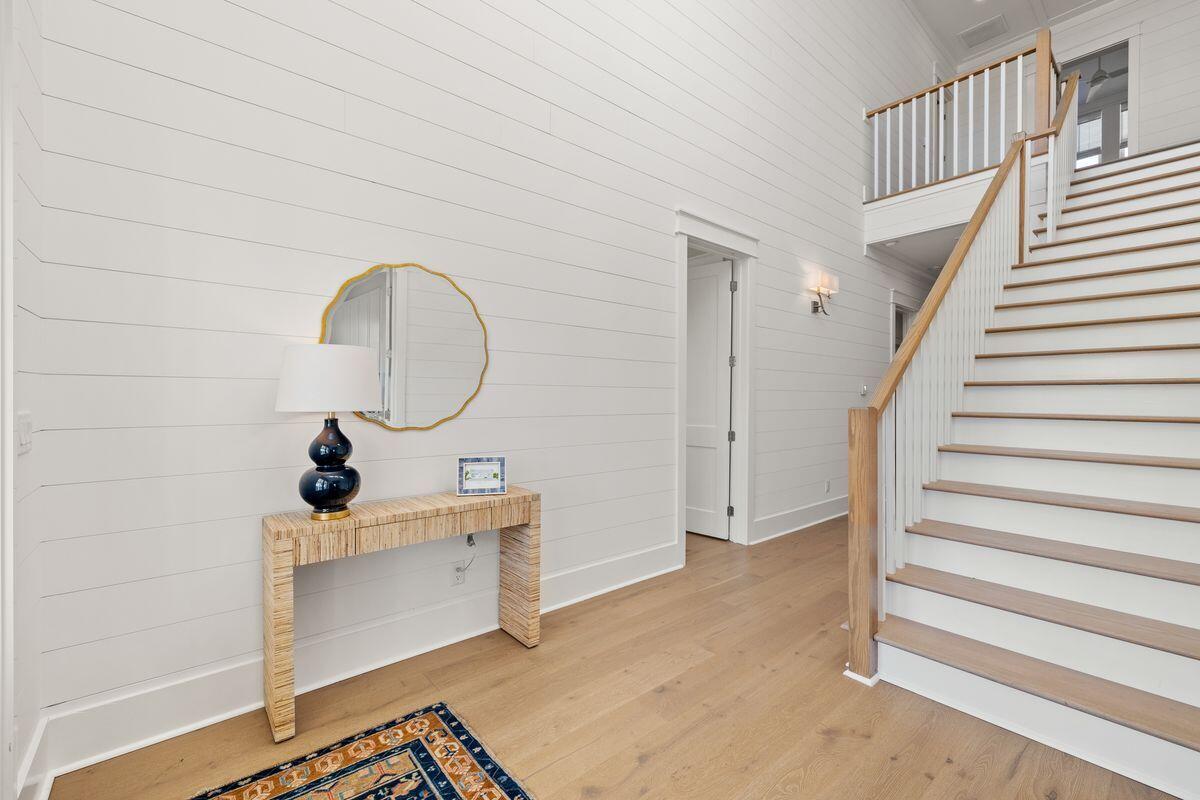 41 Seastone Ct Inlet Beach Inlet Beach, FL 32461 - Photo 30 of 52 a view of a hallway with entryway wooden floor and front door