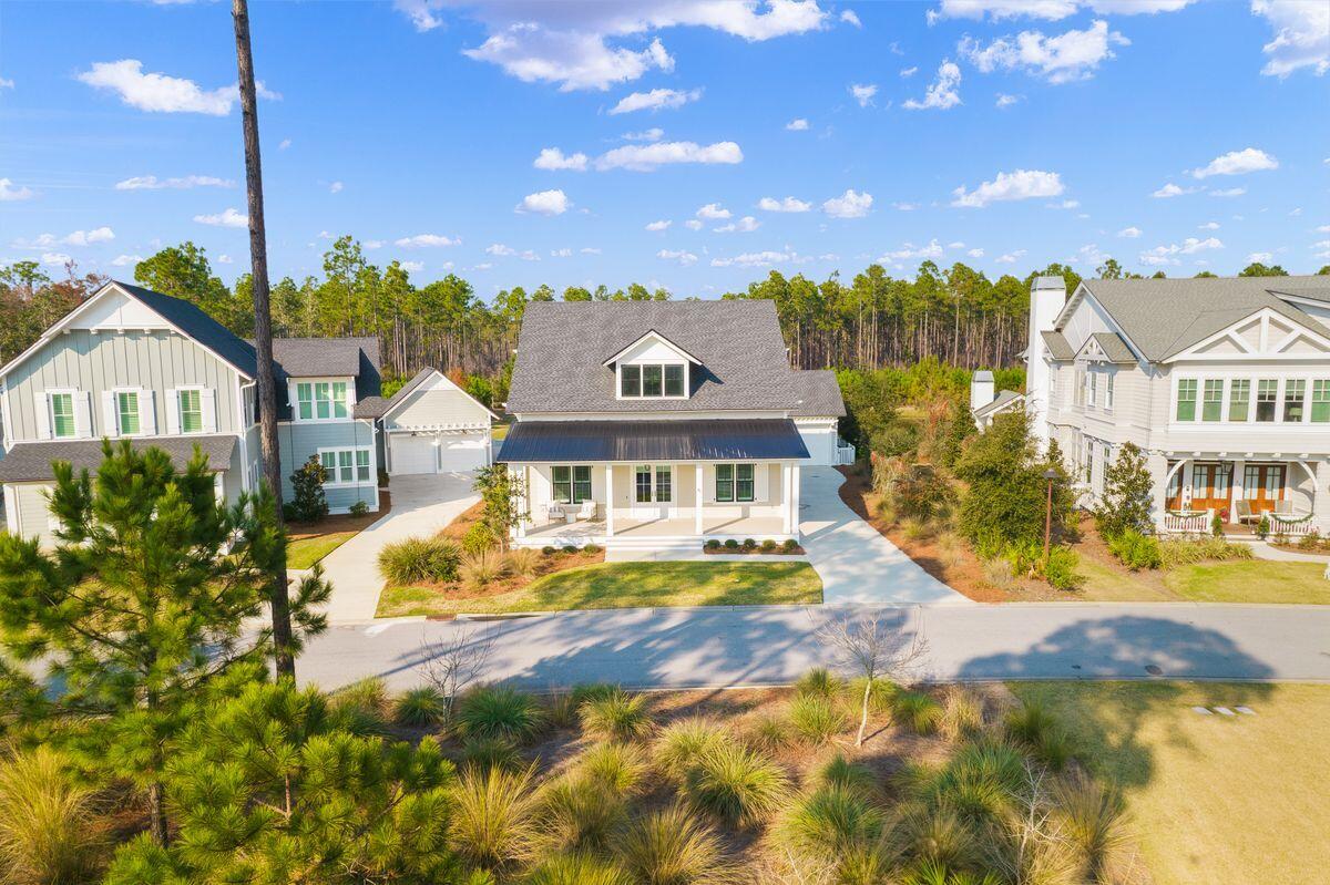 41 Seastone Ct Inlet Beach Inlet Beach, FL 32461 - Photo 44 of 52 a front view of a residential houses with yard and swimming pool