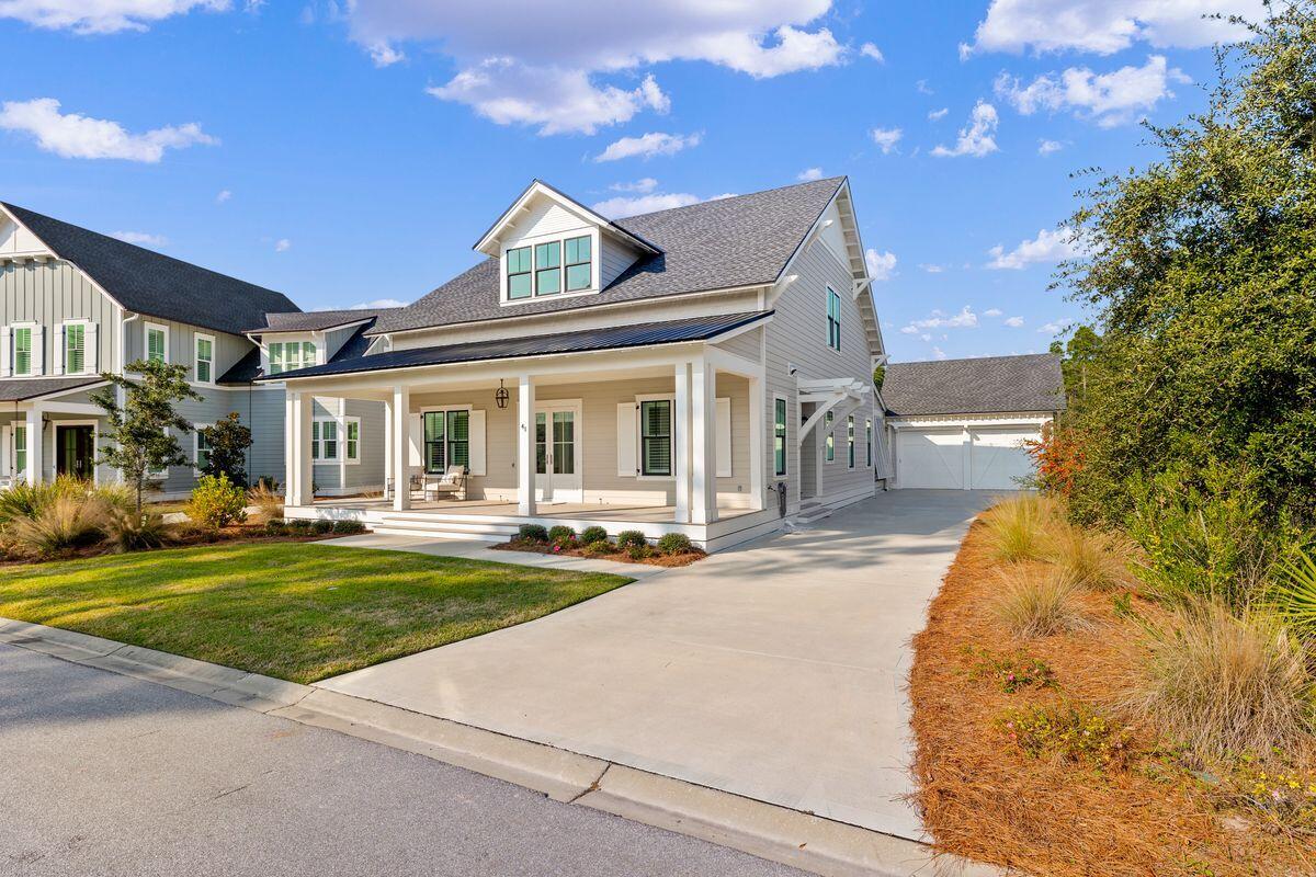 41 Seastone Ct Inlet Beach Inlet Beach, FL 32461 - Photo 5 of 52 a front view of a house with swimming pool having outdoor seating