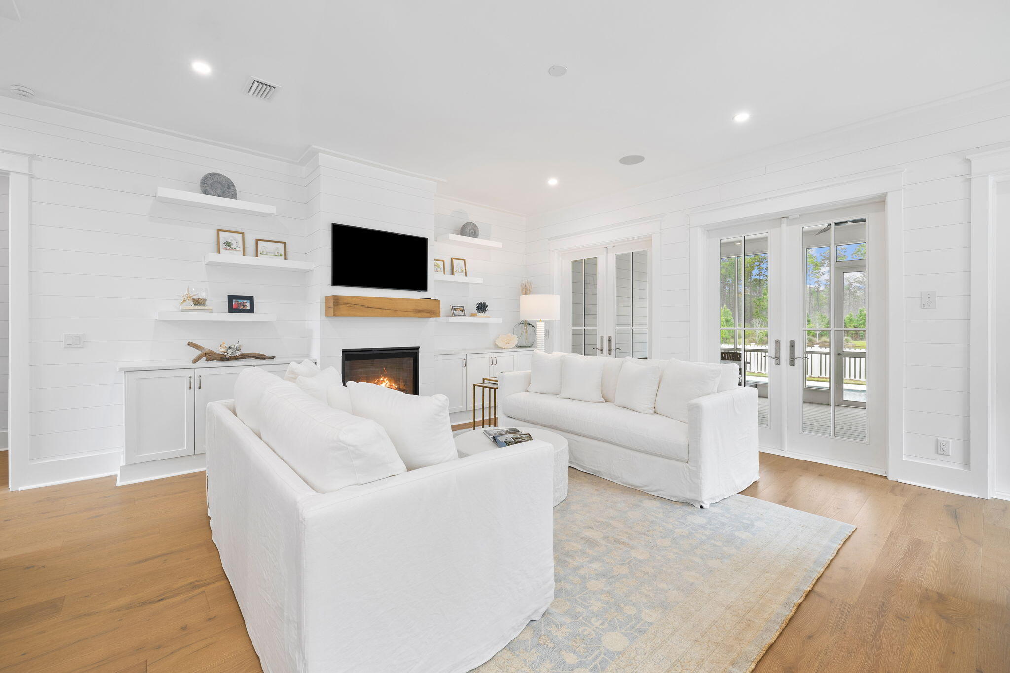 41 Seastone Ct Inlet Beach Inlet Beach, FL 32461 - Photo 6 of 52 a living room with furniture a flat screen tv and a fireplace