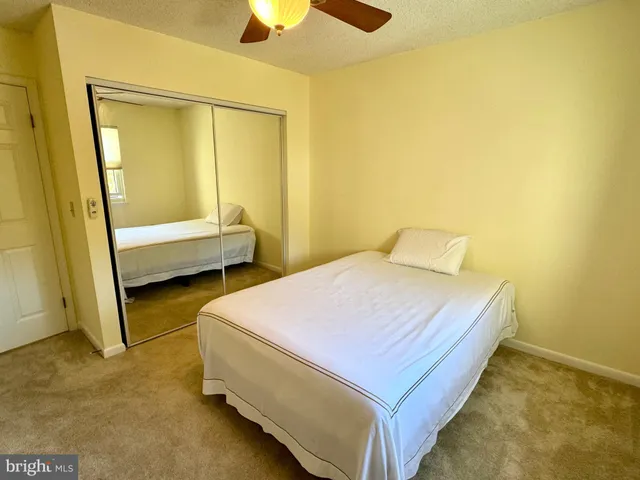 a bathroom with a sink mirror and toilet