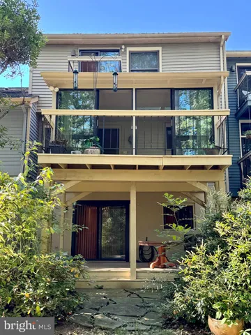 a view of house with outdoor space and sitting area