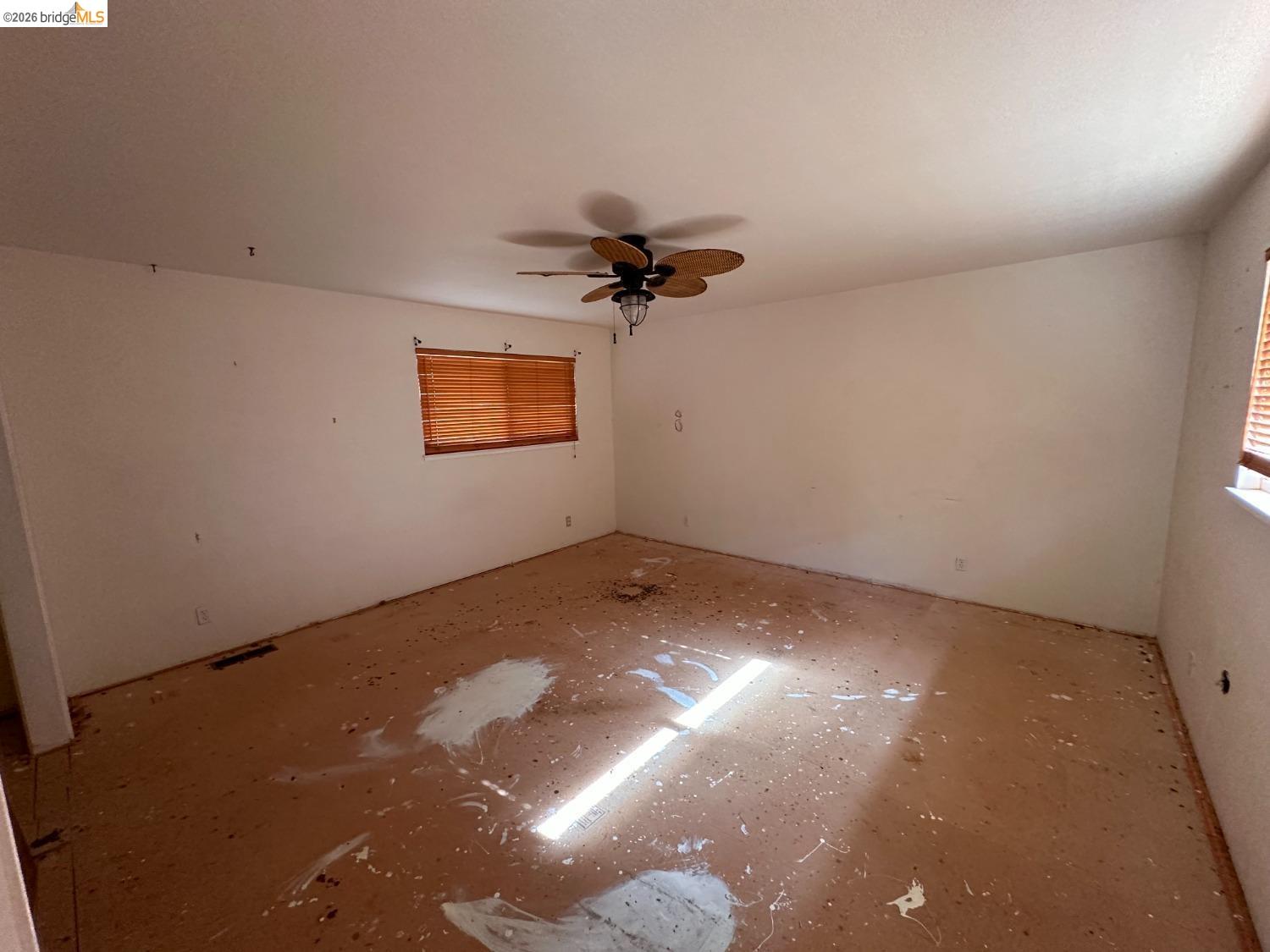 19071 West Allan Volcano, CA 95689 - Photo 11 of 42 an empty room with a ceiling fan and a window