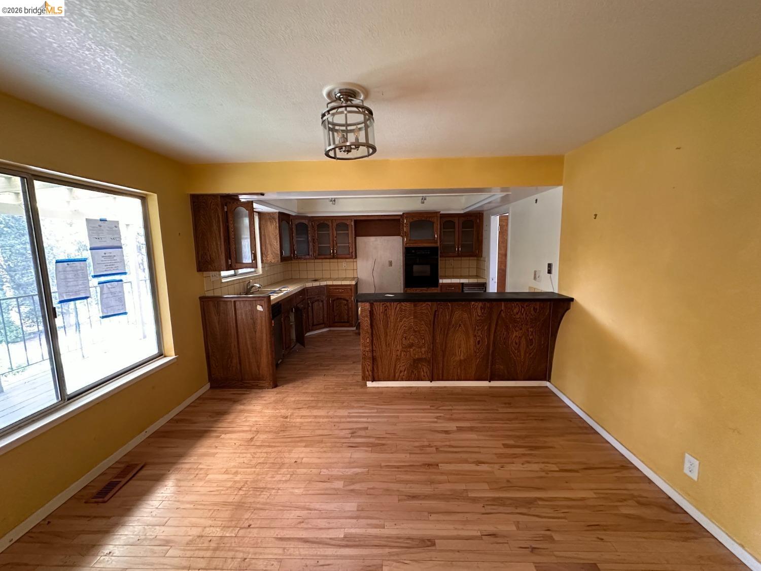 19071 West Allan Volcano, CA 95689 - Photo 19 of 42 a view of kitchen and dining room with wooden floor