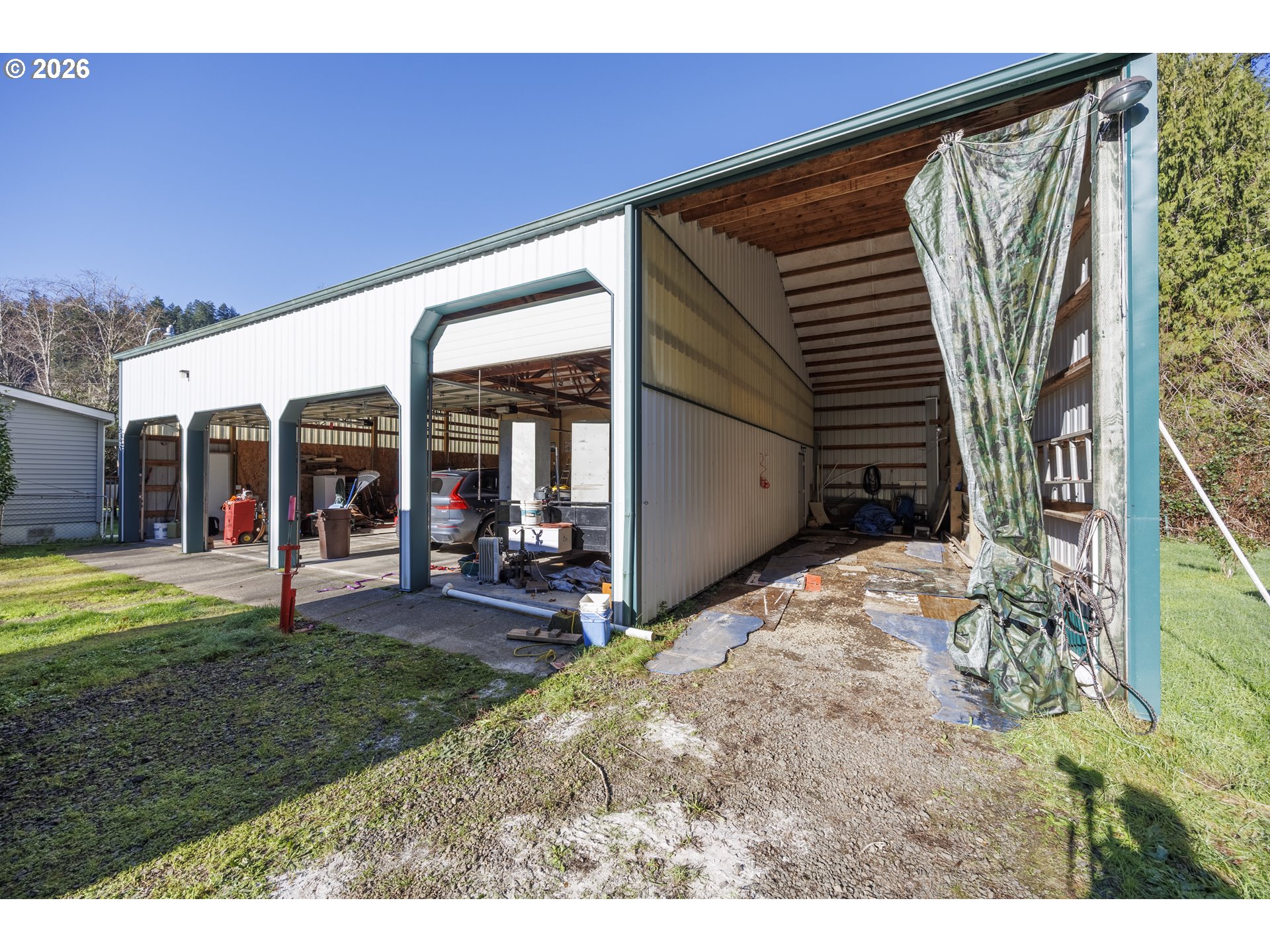 9580 North Fork Siuslaw Road Florence, OR 97439 - Photo 11 of 48 a view of a house with backyard and porch