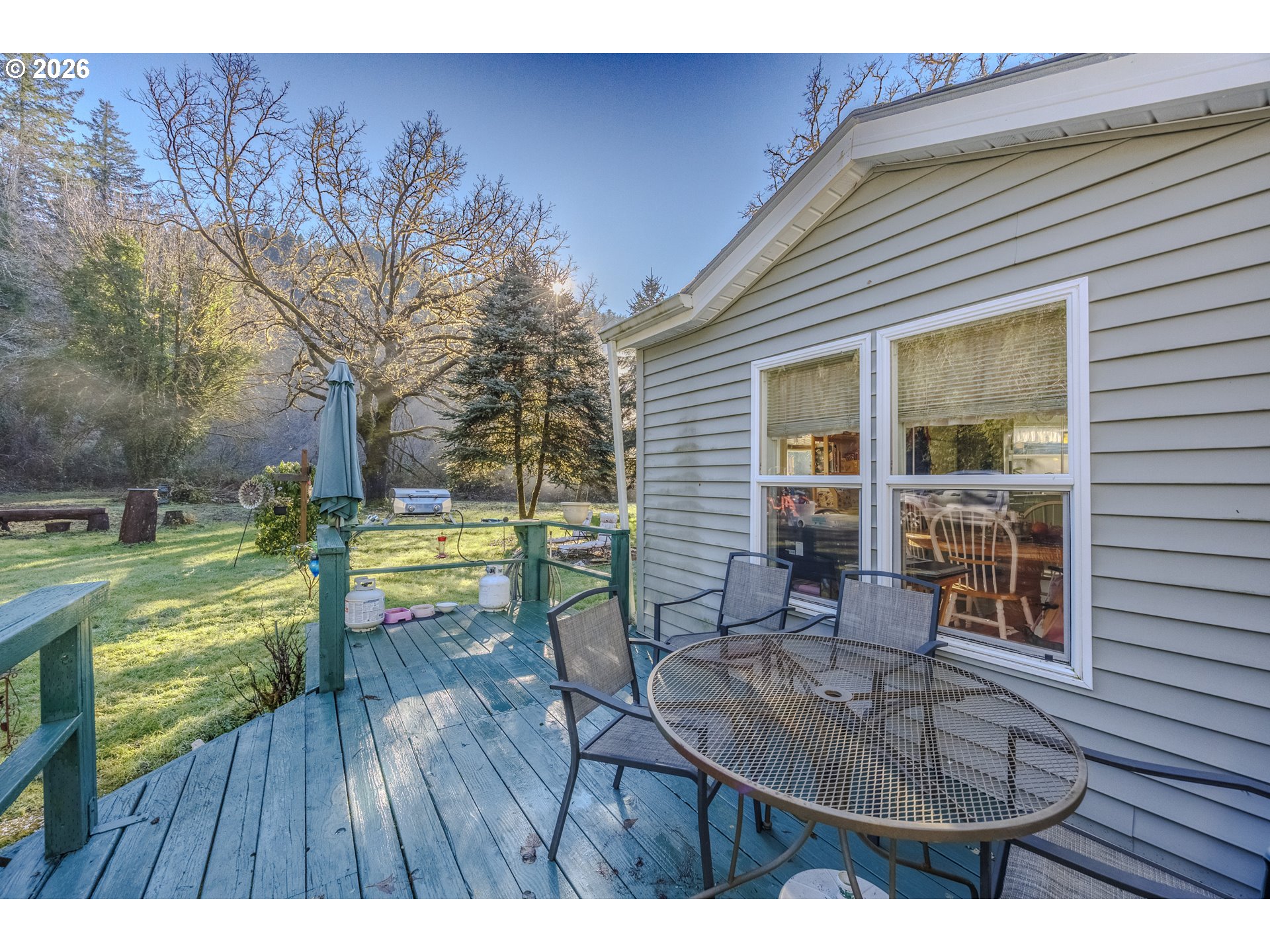 9580 North Fork Siuslaw Road Florence, OR 97439 - Photo 12 of 48 a view of a house with backyard and sitting area