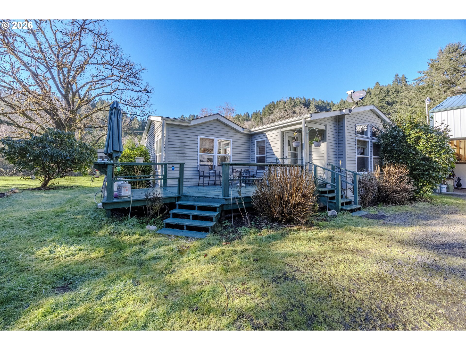 9580 North Fork Siuslaw Road Florence, OR 97439 - Photo 14 of 48 a house view with a garden space