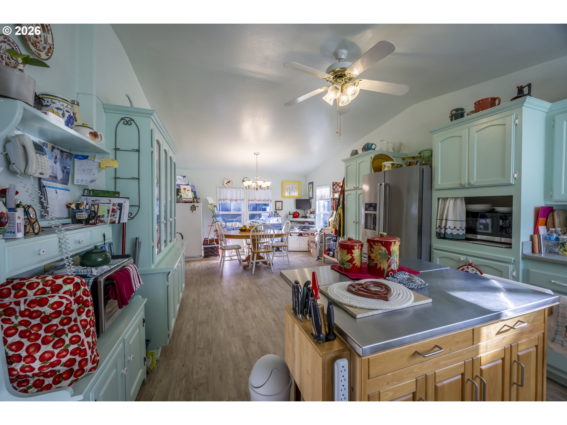 9580 North Fork Siuslaw Road Florence, OR 97439 - Photo 23 of 48 a living room with furniture kitchen view and a fireplace