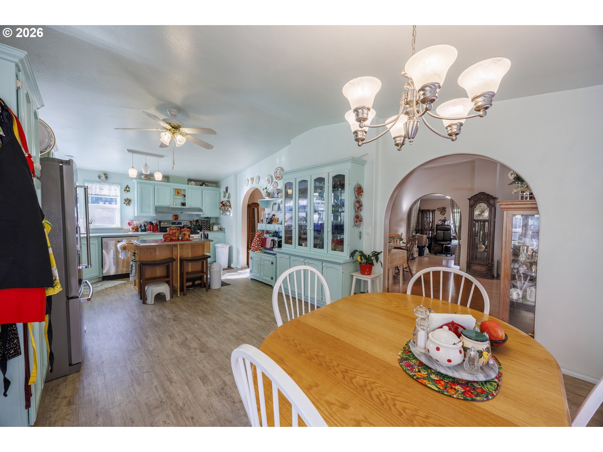 9580 North Fork Siuslaw Road Florence, OR 97439 - Photo 27 of 48 a bedroom with furniture and a chandelier